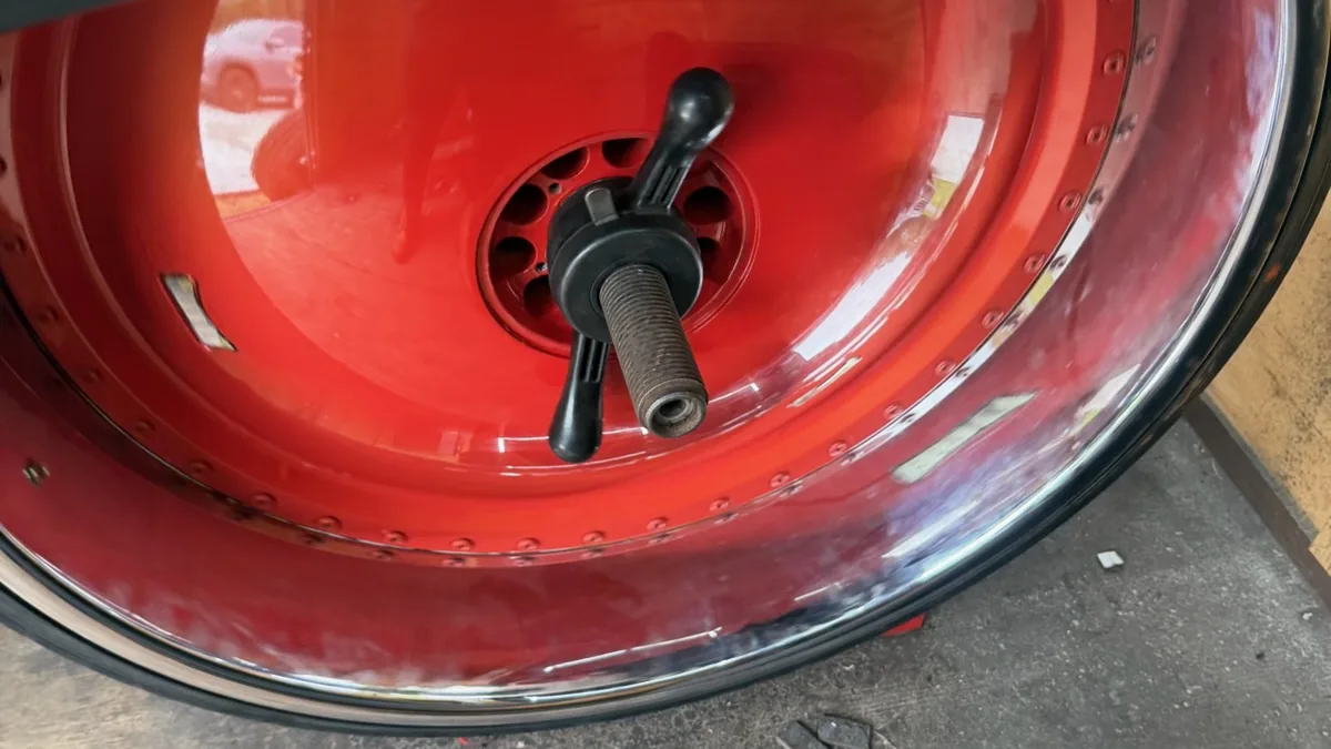 Tire on the mounting machine for an internal patch repair at Taylor Mobile Tire Service in Ocala, Florida