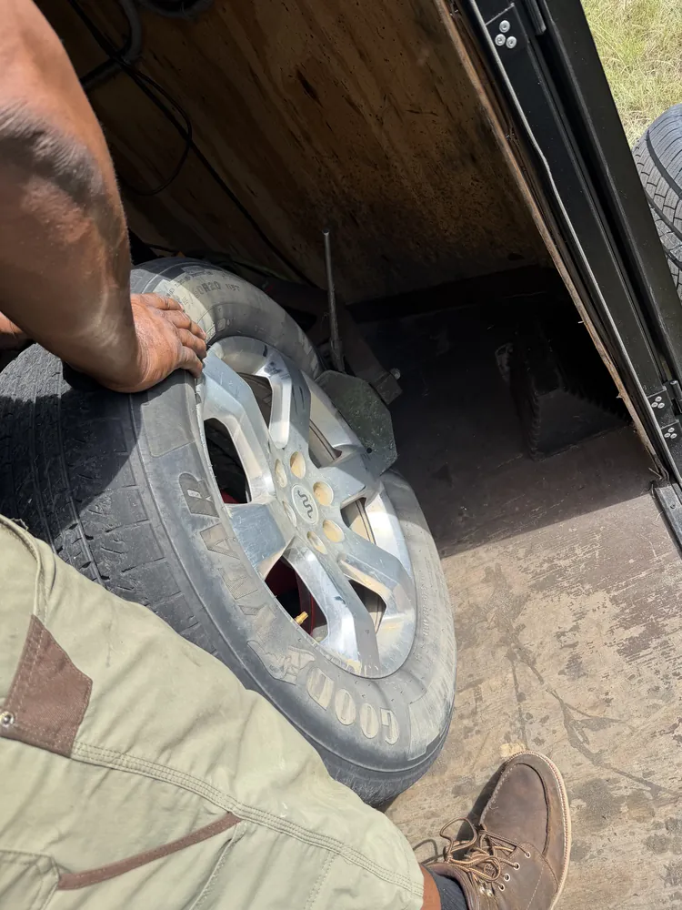 Flat tire repair on an alloy wheel at the Taylor Mobile Tire Service trailer in Ocala, Florida